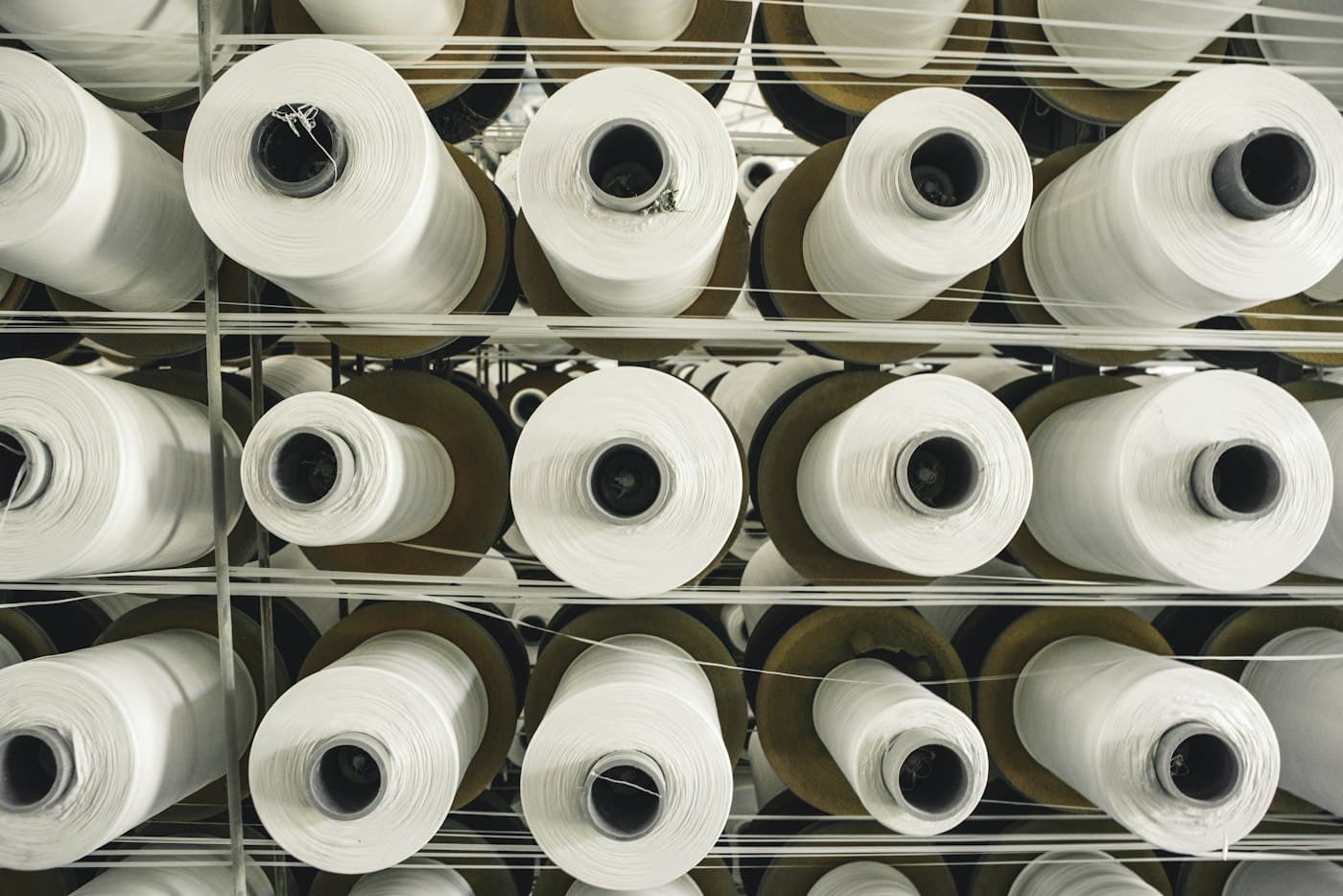 Racks of white yarn cones