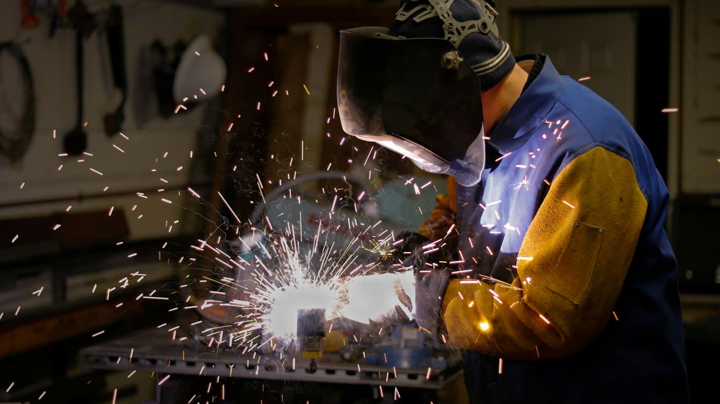 Welder working with sparks flying